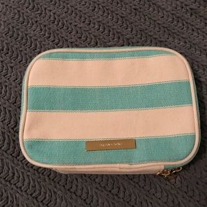 Cosmetic bag with brush holder